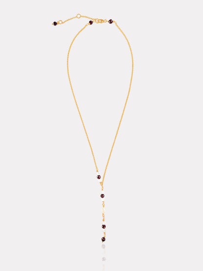 Collar corbatero bañado en oro con granates, cristal de roca y perla.